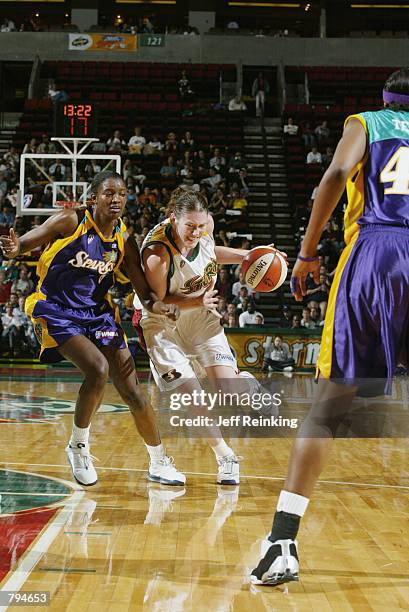 Lauren Jackson of the Seattle Storm drives past DeLisha Milton of the Los Angeles Sparks during the game on June 18, 2002 at Key Arena in Seattle,...