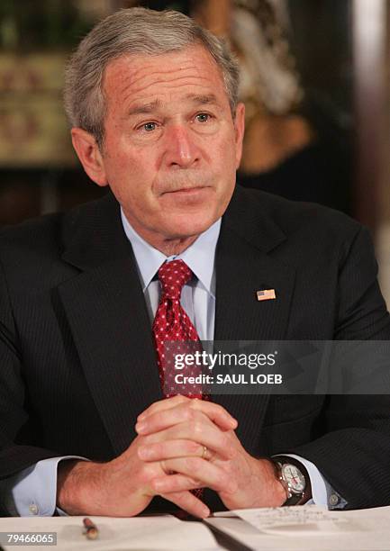 President George W. Bush speaks prior to signing a Presidential Proclamation in honor of American Heart Month at the InterContinental Hotel in Kansas...