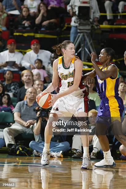Lauren Jackson of the Seattle Storm goes up against DeLisha Milton of the Los Angeles Sparks during the game on June 18, 2002 at Key Arena in...