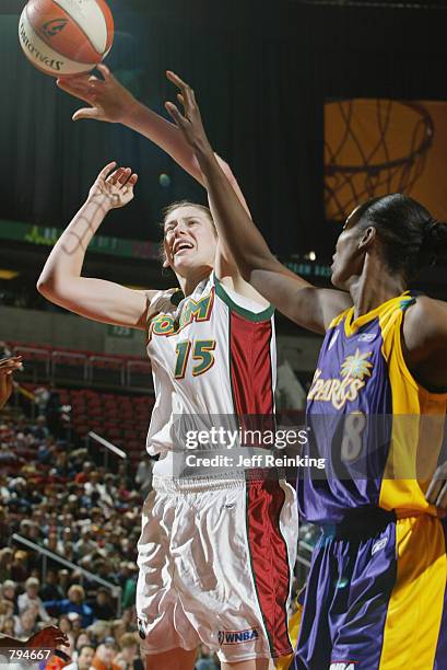 Lauren Jackson of the Seattle Storm puts up a shot over DeLisha Milton of the Los Angeles Sparks during the game on June 18, 2002 at Key Arena in...