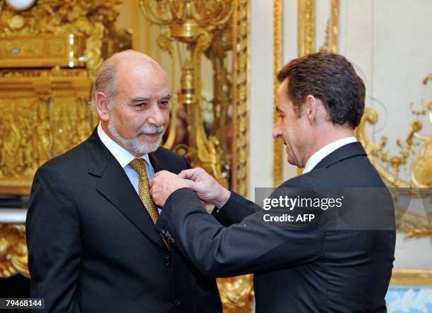 French President Nicolas Sarkozy awards Moroccan writer Tahar Ben Jelloun as Great Officer of France's Legion d'Honneur order , 01 February 2008 at...