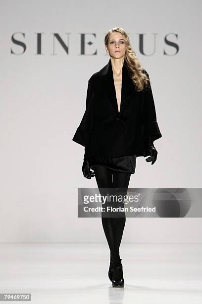 Model walks down the catwalk at the Sinemus fashion show during the Mercedes Benz Fashion Week Berlin autumn/winter 2008 on January 29, 2008 in...