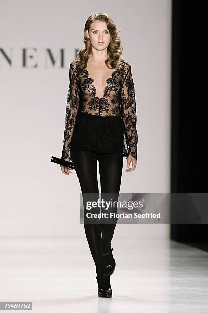 Model walks down the catwalk at the Sinemus fashion show during the Mercedes Benz Fashion Week Berlin autumn/winter 2008 on January 29, 2008 in...