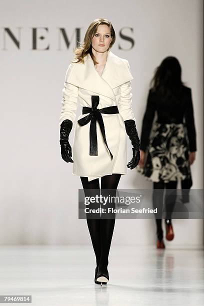 Model walks down the catwalk at the Sinemus fashion show during the Mercedes Benz Fashion Week Berlin autumn/winter 2008 on January 29, 2008 in...