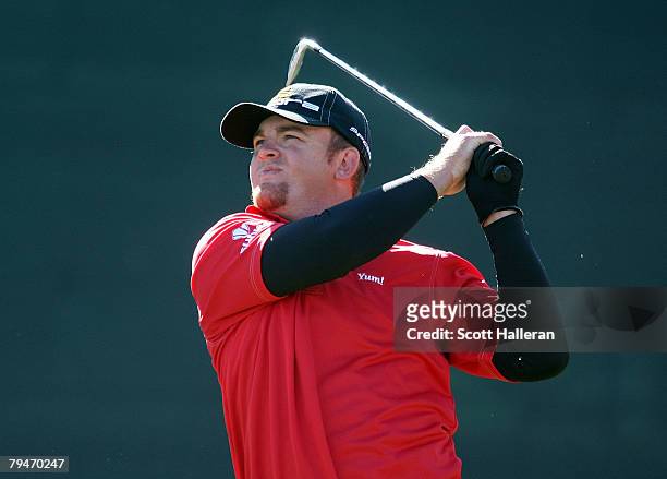 Holmes watches his tee shot on the 16th hole during the second round of the FBR Open at the TPC Scottsdale on February 1, 2008 in Scottsdale, Arizona.