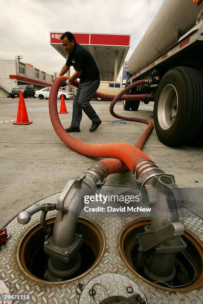 Marcos Moran delivers gasoline to an Exxon gas station on February 1, 2008 in Burbank, California. Exxon Mobil Corp. Has posted an annual profit of...