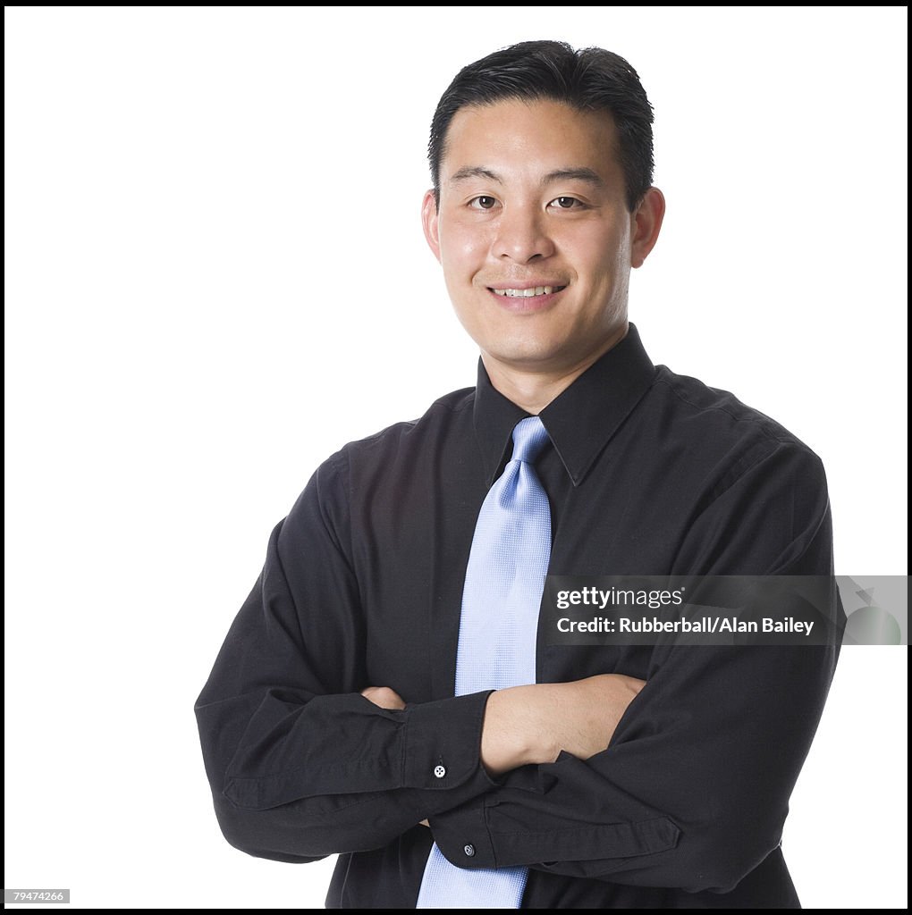 Man folding his arms and smiling