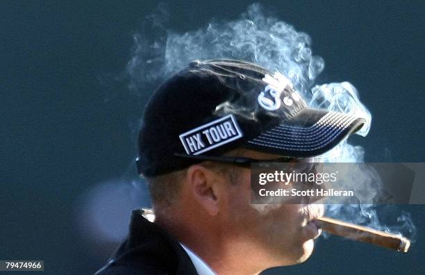 Rocco Mediate smokes a cigar during the second round of the FBR Open at the TPC Scottsdale on February 1, 2008 in Scottsdale, Arizona.