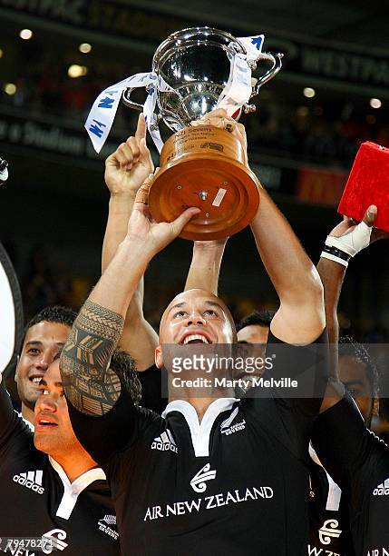 Captain of New Zealand DJ Forbes holds aloft the winners trophy after winning the final against Samoa during the New Zealand International Sevens at...