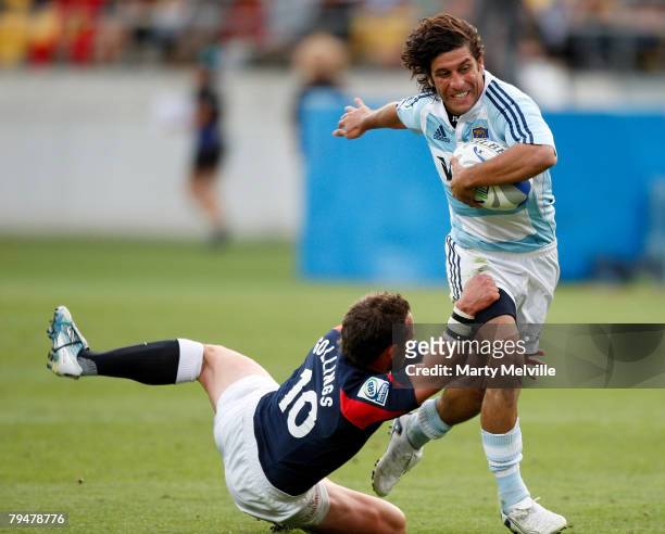 Nicolas Areil Bruzzone of Argentina gets tackled by Ben Gollings of England during a Bowl Final match between England and Argentina during the New...