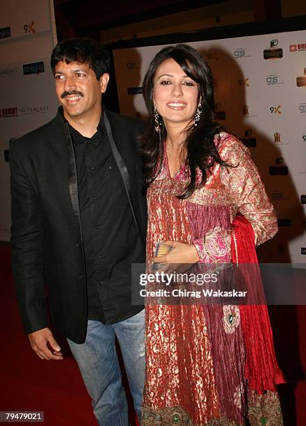 Film Director Kabir Khan & Television Host wife Mini Mathur arrives for the "The Global Indian TV Honours" held at Andheri Sports Complex February...