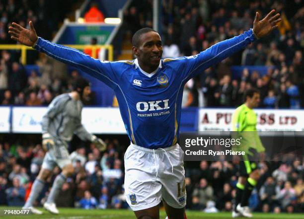 Jermain Defoe of Portsmouth celebrates after scoring his teams first goal during the Barclays Premier League match between Portsmouth and Chelsea at...