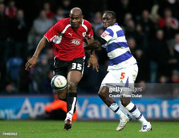 Damion Stewart of Queens Park Rangers and Dele Adebola of Bristol City head for the ball during the Queens Park Rangers v Bristol City match at...