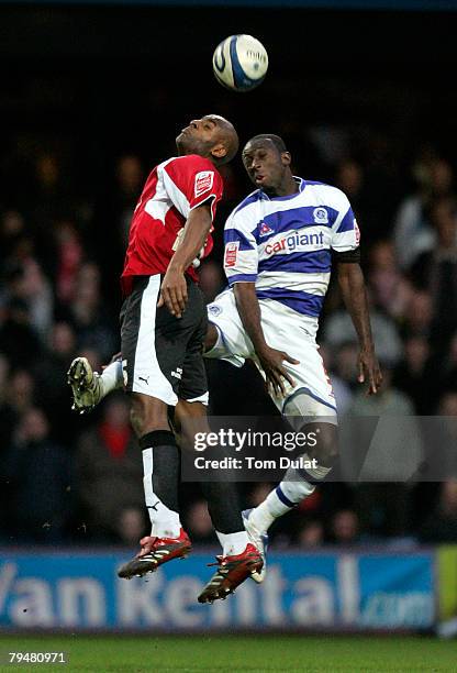 Damion Stewart of Queens Park Rangers and Dele Adebola of Bristol City head for the ball during the Queens Park Rangers v Bristol City match at...
