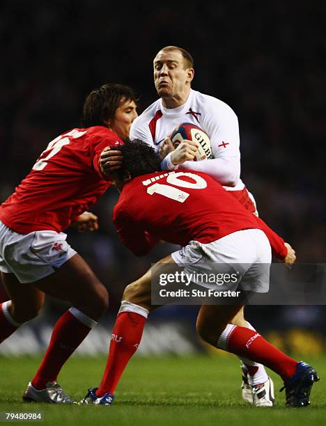 Mike Tindall of England is tackled by James Hook of Wales during the RBS Six Nations Championship match between England and Wales at Twickenham on...