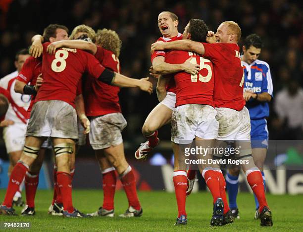 Wales players celebrate their victory as the final whistle blows during the RBS Six Nations Championship match between England and Wales at...
