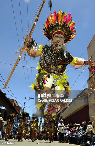 Dancers perform a typical dance from the 'tobas' -jungle tribes from the Bolivian Chaco- during the carnival of Oruro -declared Intangible Cultural...