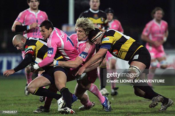 Albi's winger Recis Bianco and N?8 Vincent Clement vie with Paris' winger Julien Arias and flanker Remy Martin during their French Top 14 rugby union...