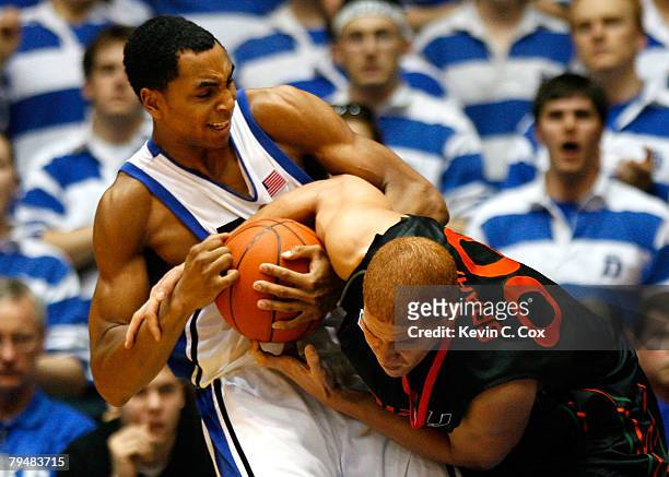 Gerald Henderson of the Duke Blue Devils battles for a rebound against Jimmy Graham of the Miami Hurricanes during the second half at Cameron Indoor...