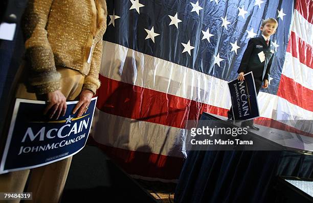 Young supporter of Republican presidential hopeful Sen. John McCain looks on during a campaign appearance at Cobb Energy Performing Arts Centre...