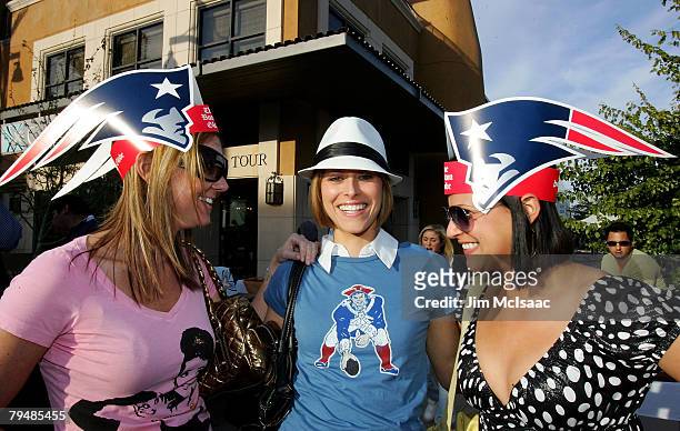 Fans of the New England Patriots pose for a photograph on February 2, 2008 in downtown Scottsdale, Arizona.
