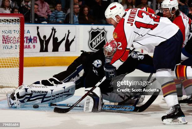 Goaltender Karri Ramo of the Tampa Bay Lightning makes a save against Olli Jokinen of the Florida Panthers at St. Pete Times Forum February 2, 2008...