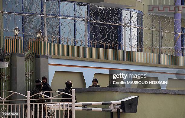 Security men of notorious Afghan warlord General Abdul Rashid Dostum stand guard at his house in Kabul which was surrounded by more than 150...