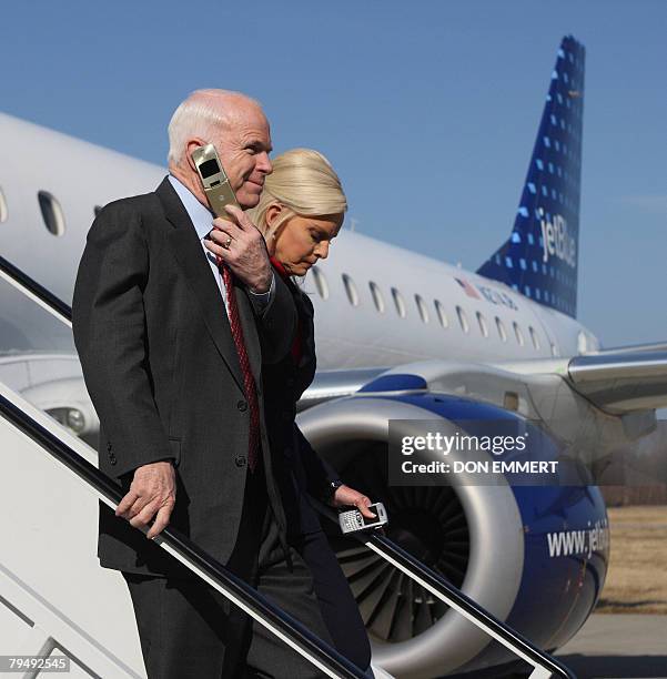 Republican presidential hopeful Arizona Senator John McCain and his wife Cindy arrive at Westchester County airport in White Plains, New York, 03...