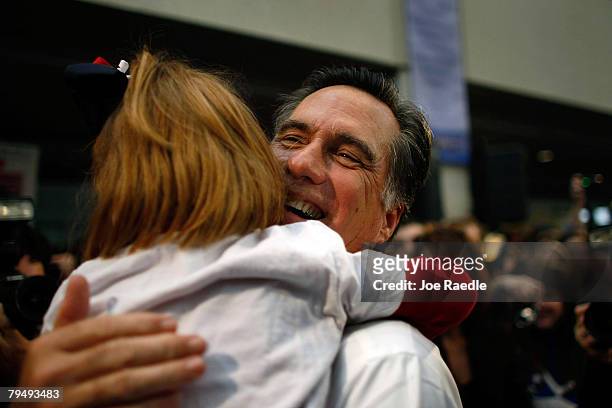 Republican presidential candidate and former Massachusetts governor Mitt Romney is hugged by Eloise Nyhan Denker during a campaign stop at the...