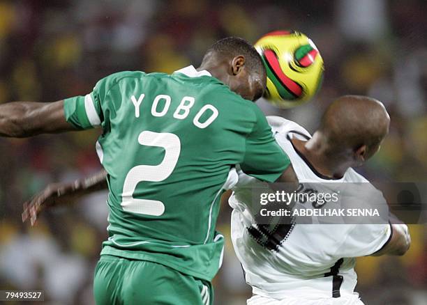 Ghana's Junior Agogo fights for the ball with Nigeria's Joseph Yobo 03 February 2008 in Accra during their quarter-final 2008 African Cup of Nations...