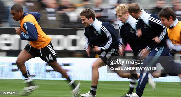 Michael Owen of Newcastle United warms up with team mates before the English Premier league football match against Middlesbrough at St James Park, in...
