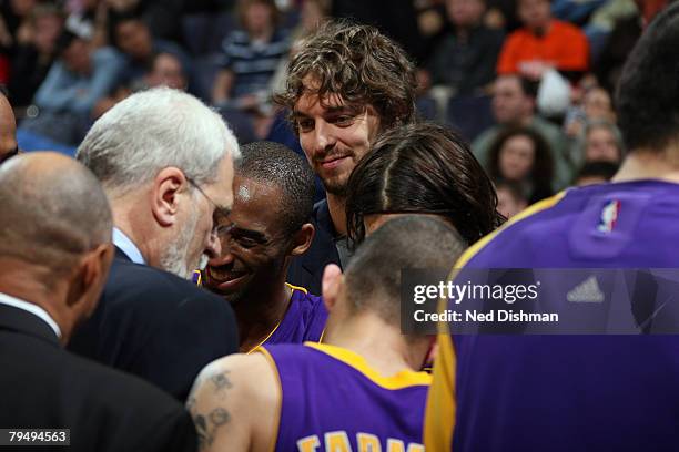 Pau Gasol and Kobe Bryant of the Los Angeles Lakers smile in the huddle during game against the Washington Wizards at the Verizon Center on February...