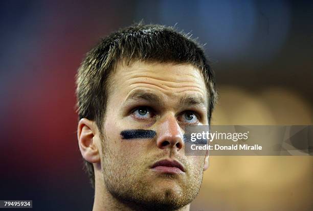 Tom Brady of of the New England Patriots waits on the field before taking on the New York Giants during Super Bowl XLII on February 3, 2008 at the...