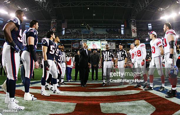 Hall of Famer Ronnie Lott performs the coin toss before the New York Giants take on the New England Patriots during Super Bowl XLII on February 3,...