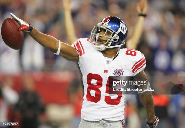 David Tyree of the New York Giants celebrates his five-yard touchdown reception in the fourth quarter against the New England Patriots during Super...