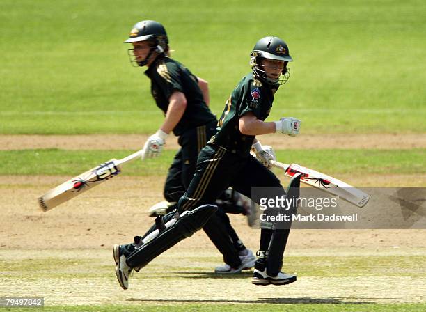 Alex Blackwell of the Southern Stars and her sister Kate Blackwell cross for a quick single during the Women's One Day International match between...
