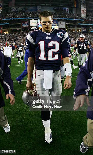 Tom Brady of the New England Patriots walks off the field after losing to the New York Giants 17-14 in Super Bowl XLII on February 3, 2008 at the...