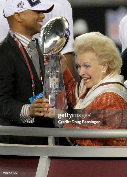 Ann Mara, mother of John Mara, co-owner of the New York Giants celebrates with the Vince Lombardi trophy after the won 17-14 against the New England...
