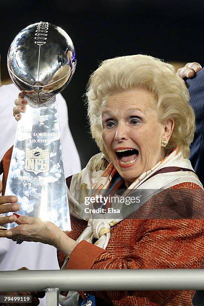 Ann Mara, mother of John Mara, co-owner of the New York Giants celebrates with the Vince Lombardi trophy after the won 17-14 against the New England...