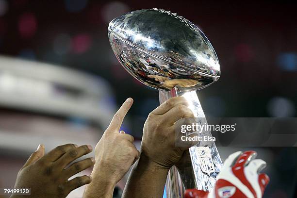 The New York Giants holds the Vince Lombardi Trophy after defeating the New England Patriots 17 0 14 after Super Bowl XLII on February 3, 2008 at the...