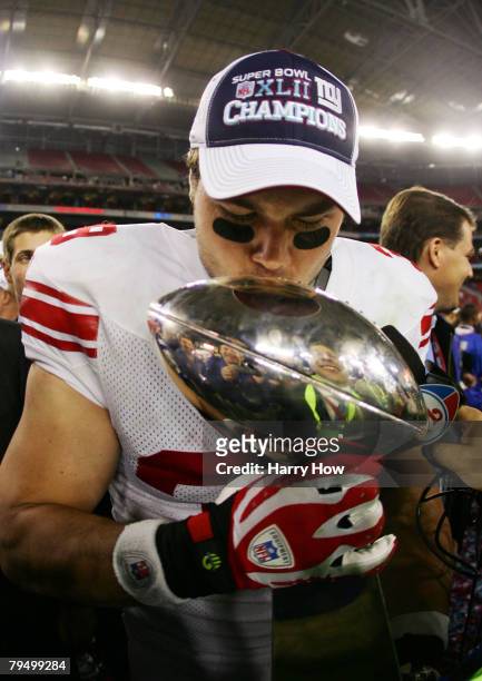 Madison Hedgecock of the New York Giants kisses the Vince Lombardi Trophy after defeating the New England Patriots 17-14 in Super Bowl XLII on...