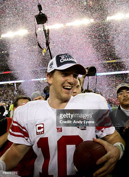 Quarterback Eli Manning of the New York Giants walks off the field after the Giants defeated the New England Patriots 17-14 during Super Bowl XLII on...