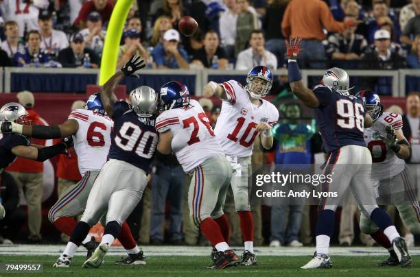 Quarterback Eli Manning of the New York Giants throws the ball during Super Bowl XLII against the New England Patriots on February 3, 2008 at the...