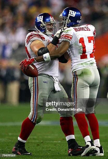 Wide receiver Plaxico Burress and Shaun O'Hara of the New York Giants celebrate Burress' 13-yard touchdown pass in the fourth quarter against the New...