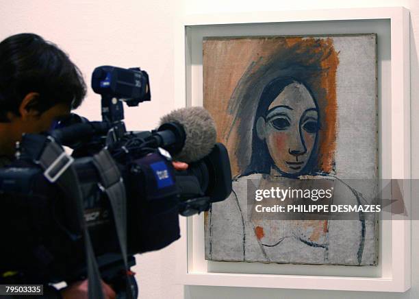 Cameraman films the painting " Head and Shoulders of a woman part of the Picasso exhibition from the collections of the French National Museum...