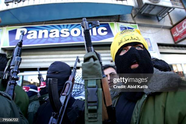 Masked gunmen attend a press conference while Abu Thaer a Palestinian spokesman of the Al-Aqsa Brigades the military wing of the Palestinian...