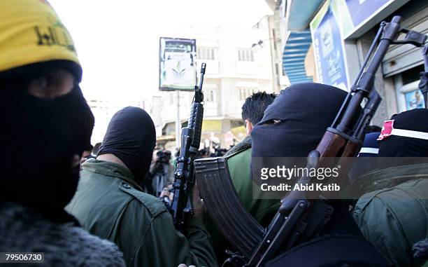 Masked gunmen attend a press conference while Abu Thaer a Palestinian spokesman of the Al-Aqsa Brigades the military wing of the Palestinian...