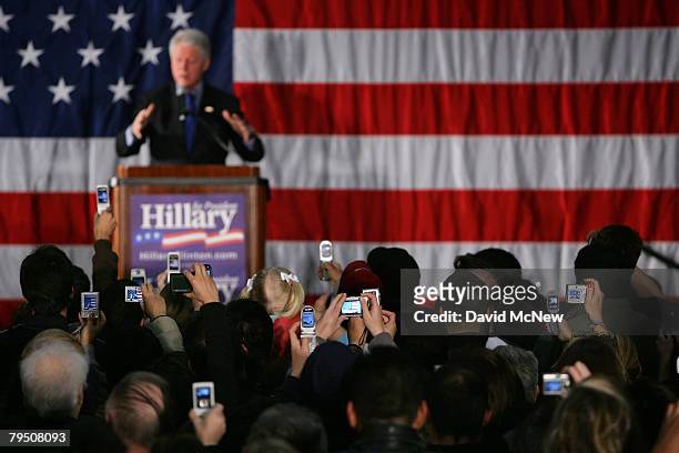 Crowd of supporters use digital cameras to photograph former U.S. President Bill Clinton as he campaigns for his wife and Democratic presidential...