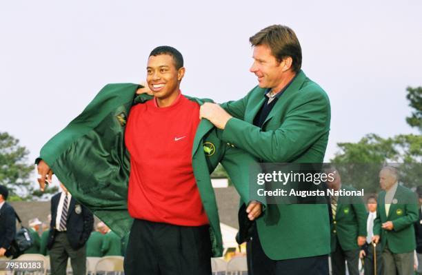 Tiger Woods Puts On The Green Jacket With The Help Of Nick Faldo During The Presentation Ceremony Of The 1997 Masters Tournament