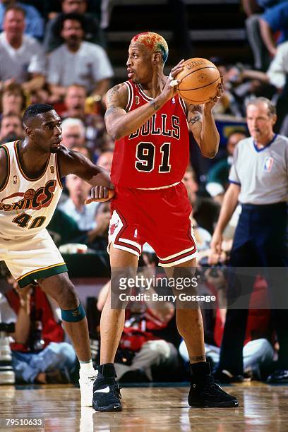 Dennis Rodman of the Chicago Bulls looks to make a move against Shawn Kemp of the Seattle SuperSonics in Game Four of the 1996 NBA Finals at Key...